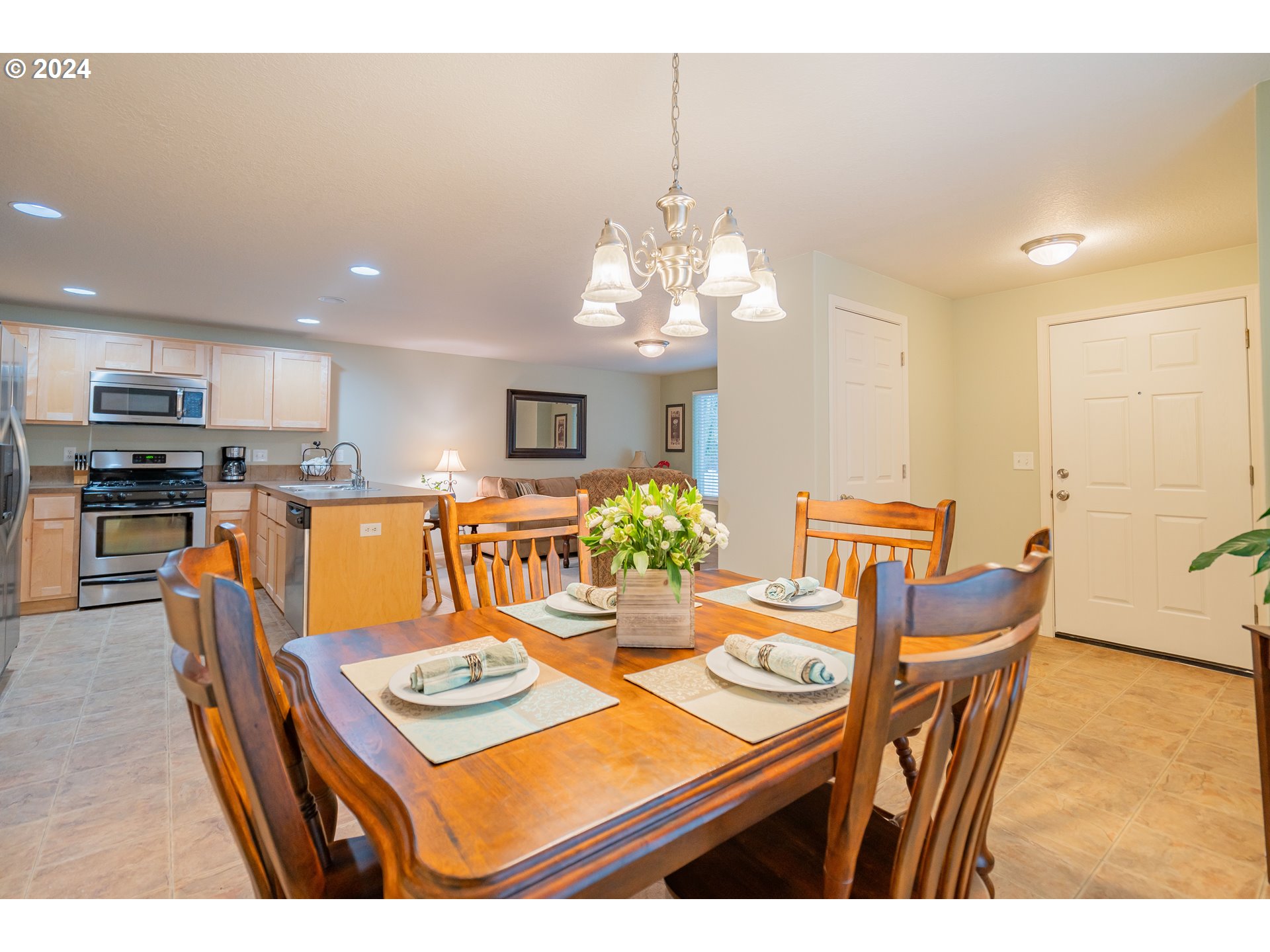 1420 Southeast 5th Way Battle Ground, WA 98604 - Photo 4 of 32 a view of a dining room with furniture and a chandelier