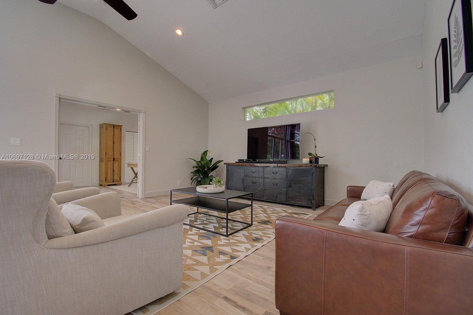 541 Ranch Road Weston, FL 33326 - Photo 14 of 41 a living room with furniture and a flat screen tv