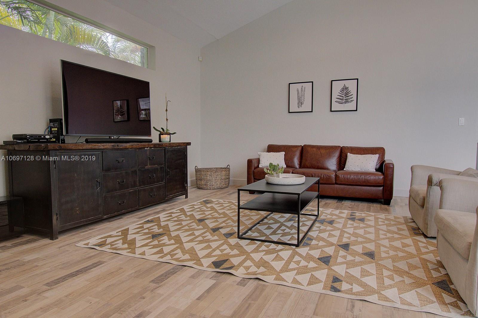 541 Ranch Road Weston, FL 33326 - Photo 15 of 41 a living room with furniture and a flat screen tv