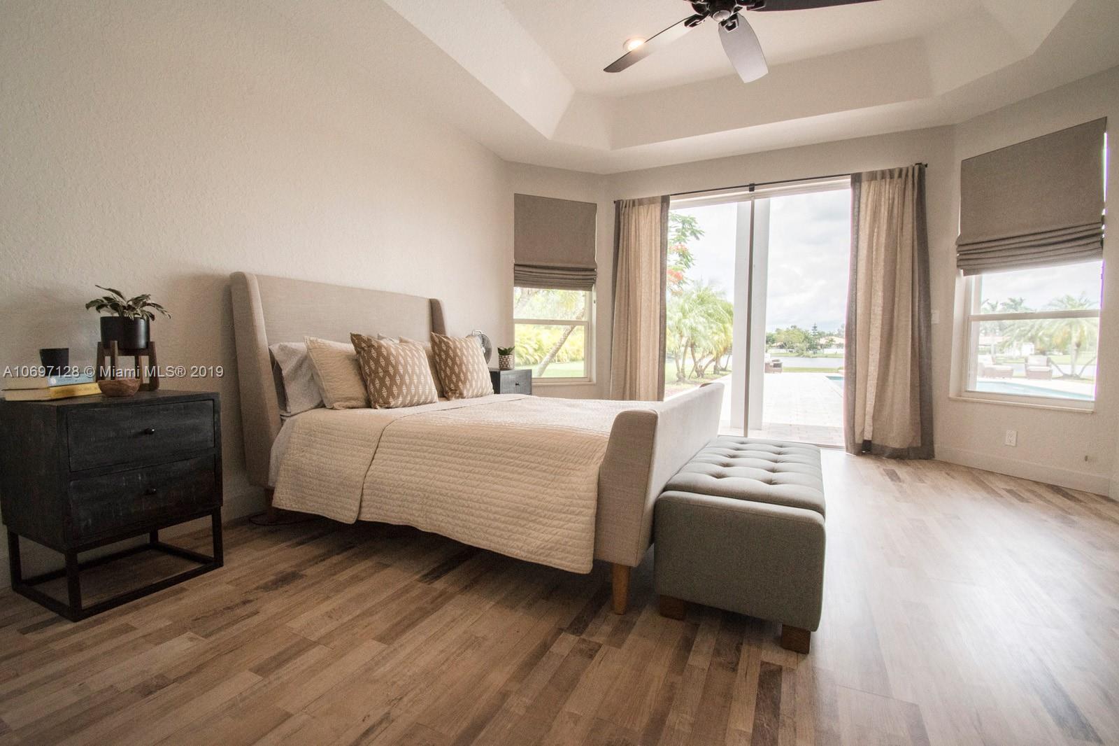 541 Ranch Road Weston, FL 33326 - Photo 16 of 41 a bedroom with a bed and a window