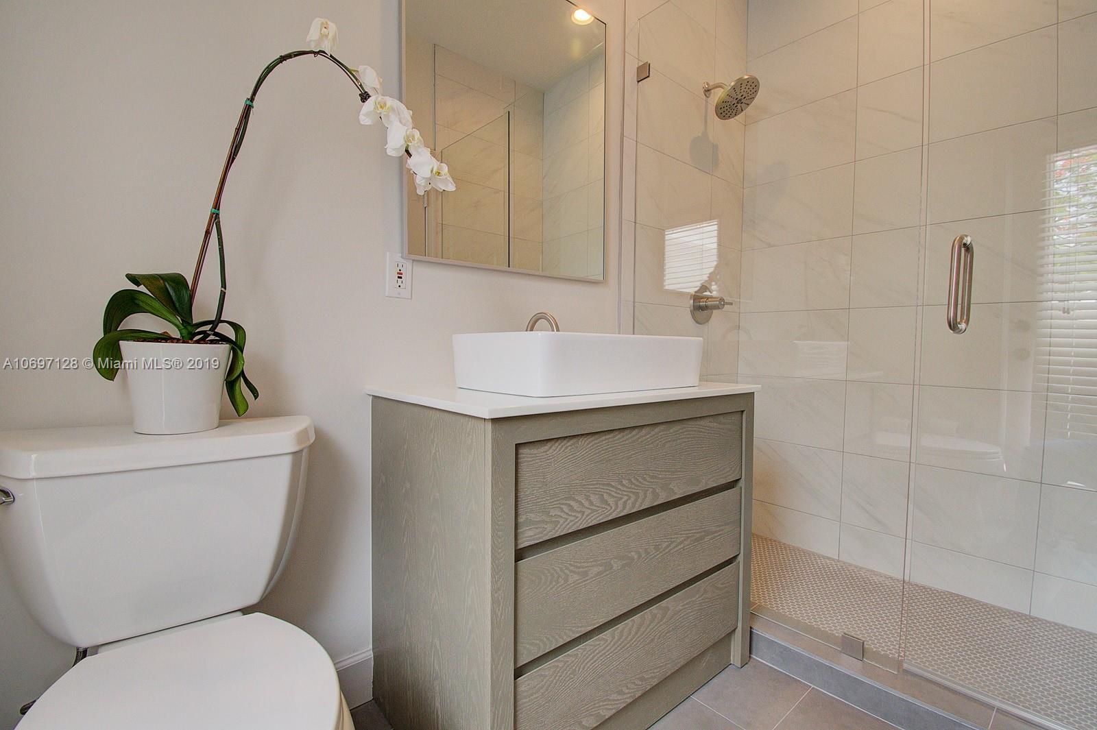 541 Ranch Road Weston, FL 33326 - Photo 24 of 41 a bathroom with a sink toilet and shower