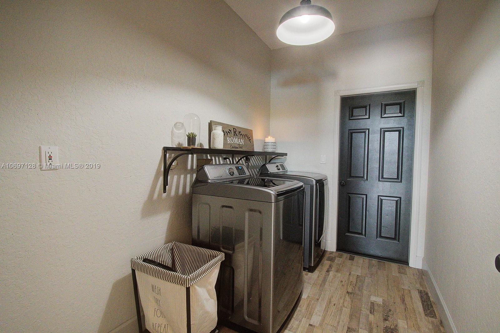 541 Ranch Road Weston, FL 33326 - Photo 27 of 41 a utility room with dryer and washer