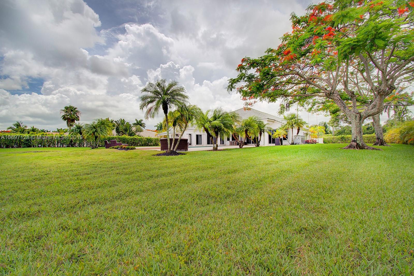 541 Ranch Road Weston, FL 33326 - Photo 30 of 41 a view of building with outdoor space