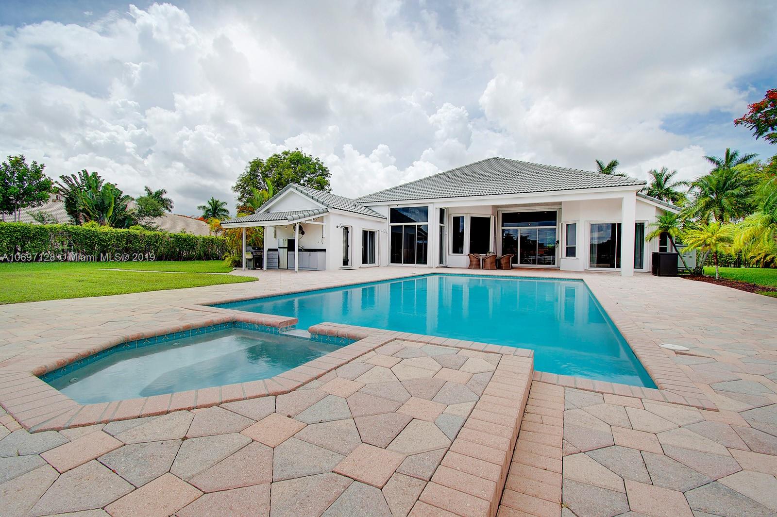 541 Ranch Road Weston, FL 33326 - Photo 32 of 41 a view of house with a yard and potted plants