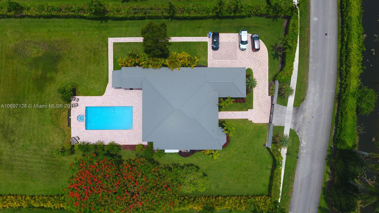 541 Ranch Road Weston, FL 33326 - Photo 35 of 41 an aerial view of a house with outdoor space lake lake view