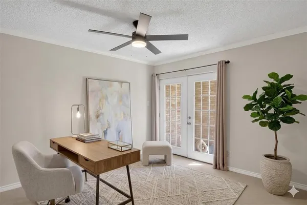 a view of a livingroom with furniture and a potted plant