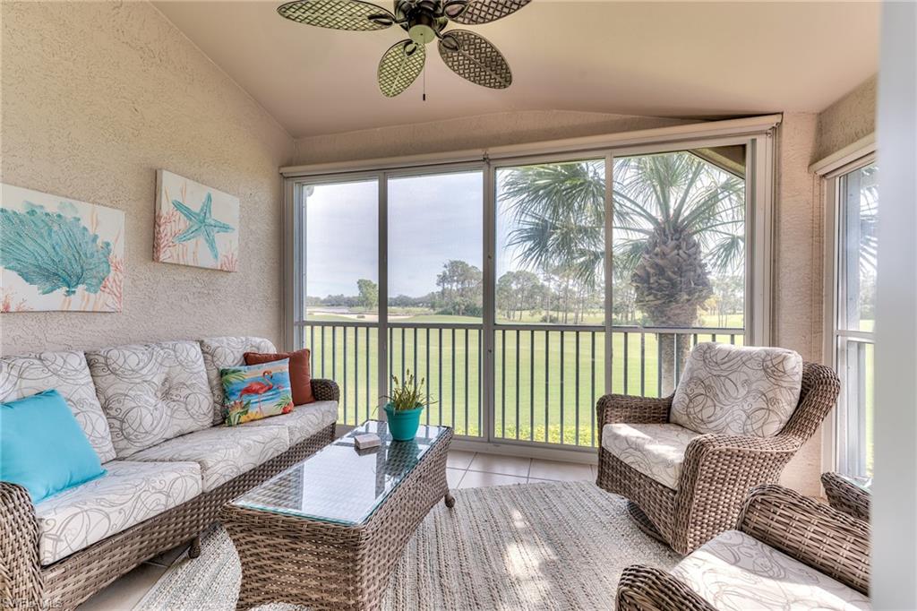 9281 Spring Run Boulevard, Unit 2602 Estero, FL 34135 - Photo 3 of 36 a living room with furniture and a large window