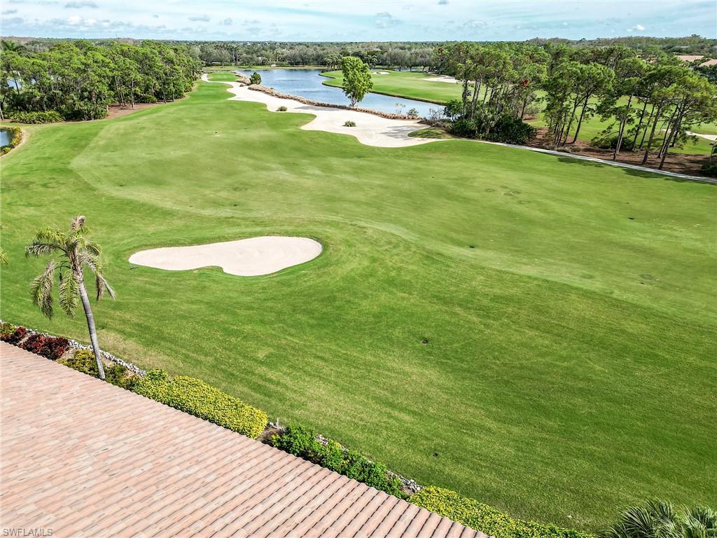 9281 Spring Run Boulevard, Unit 2602 Estero, FL 34135 - Photo 35 of 36 a view of a field with an ocean