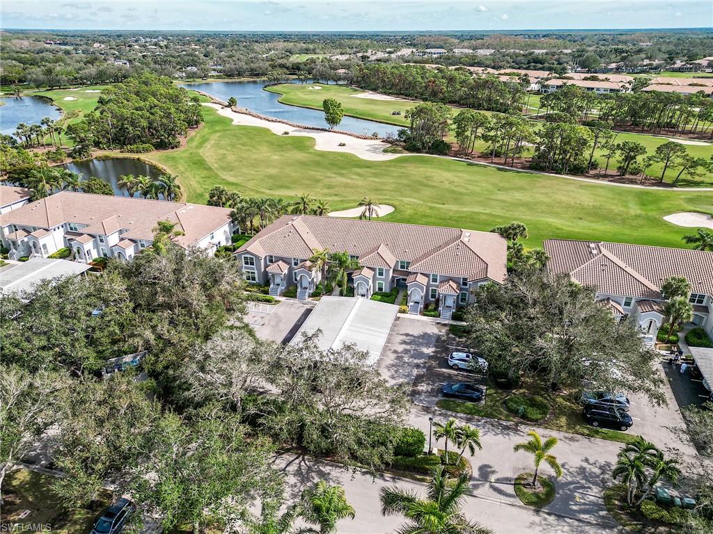 9281 Spring Run Boulevard, Unit 2602 Estero, FL 34135 - Photo 36 of 36 an aerial view of residential houses with outdoor space and river