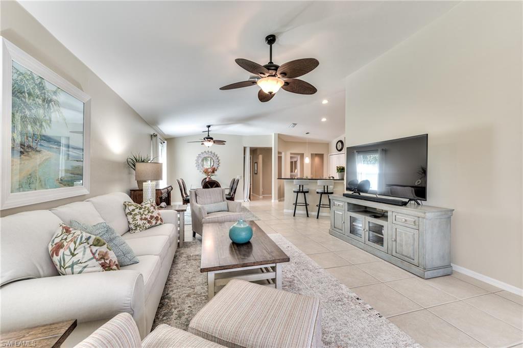 9281 Spring Run Boulevard, Unit 2602 Estero, FL 34135 - Photo 8 of 36 a living room with furniture and a flat screen tv