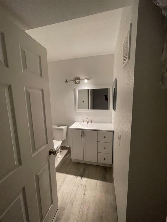 8100 Geneva Court, Unit 535 Doral, FL 33166 - Photo 12 of 27 a bathroom with a sink a toilet and mirror