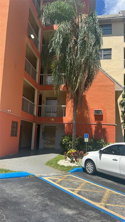 8100 Geneva Court, Unit 535 Doral, FL 33166 - Photo 3 of 27 a view of a car parked in front of a brick house