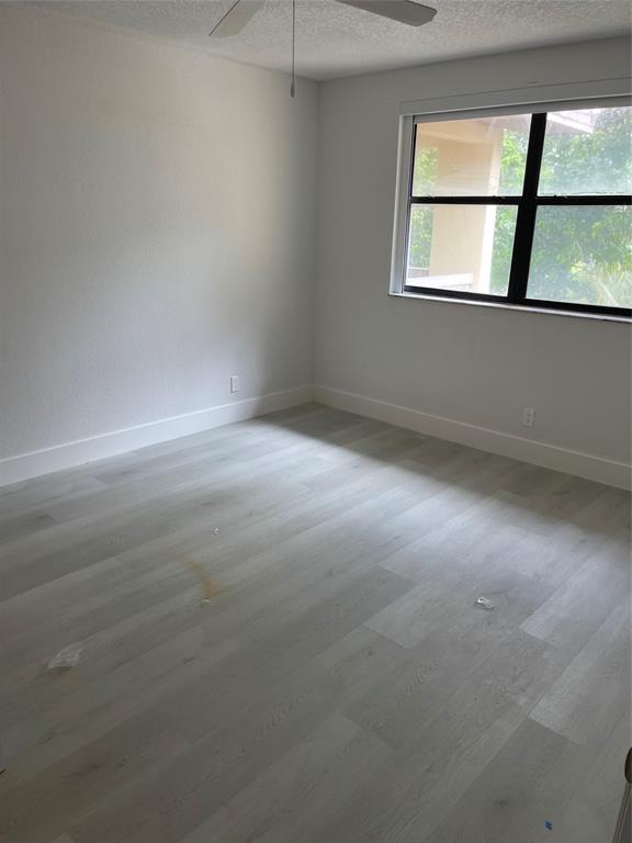 8100 Geneva Court, Unit 535 Doral, FL 33166 - Photo 4 of 27 an empty room with a window