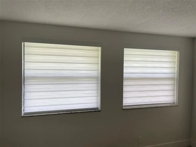 a bathroom with a double vanity sink toilet mirror and bathtub