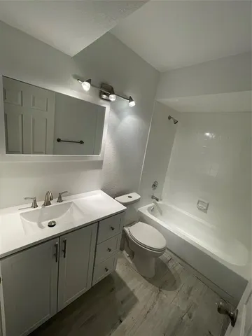 a bathroom with a tub and a shower