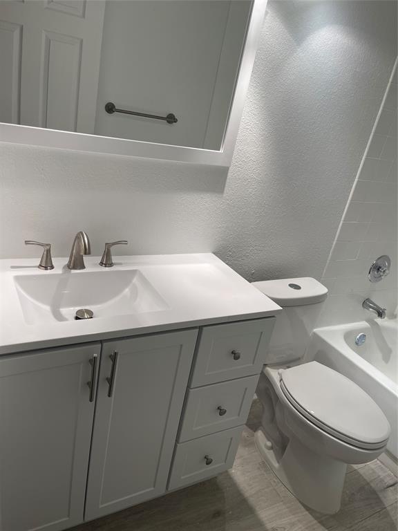 8100 Geneva Court, Unit 535 Doral, FL 33166 - Photo 9 of 27 a bathroom with a sink and a toilet