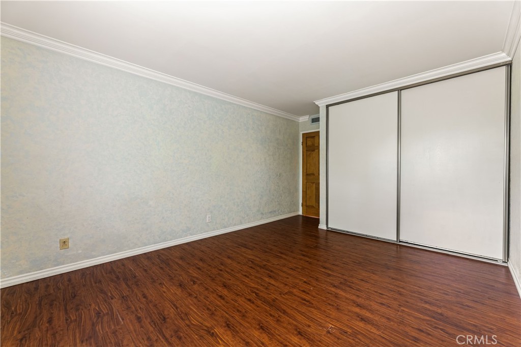 12300 Montecito Road, Unit 42 Seal Beach, CA 90740 - Photo 16 of 44 a view of an empty room with wooden floor
