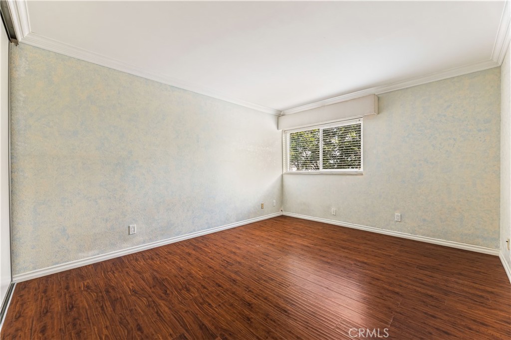 12300 Montecito Road, Unit 42 Seal Beach, CA 90740 - Photo 17 of 44 an empty room with wooden floor and windows