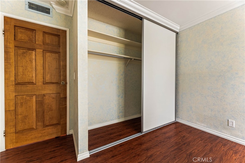 12300 Montecito Road, Unit 42 Seal Beach, CA 90740 - Photo 18 of 44 a view of an empty room with wooden floor