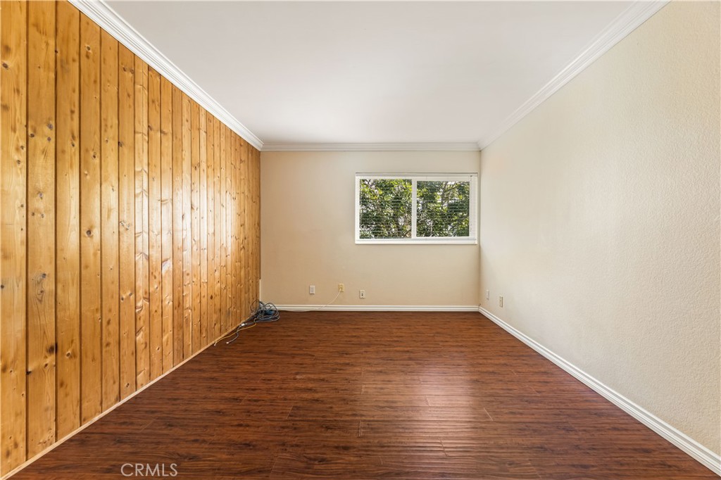 12300 Montecito Road, Unit 42 Seal Beach, CA 90740 - Photo 20 of 44 an empty room with wooden floor and windows