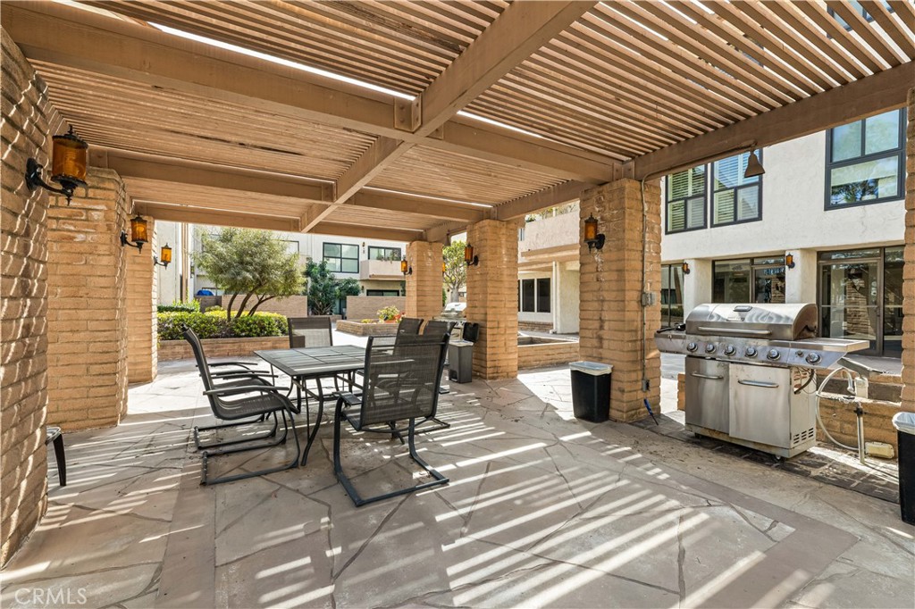 12300 Montecito Road, Unit 42 Seal Beach, CA 90740 - Photo 40 of 44 a dining room with furniture and wooden floor