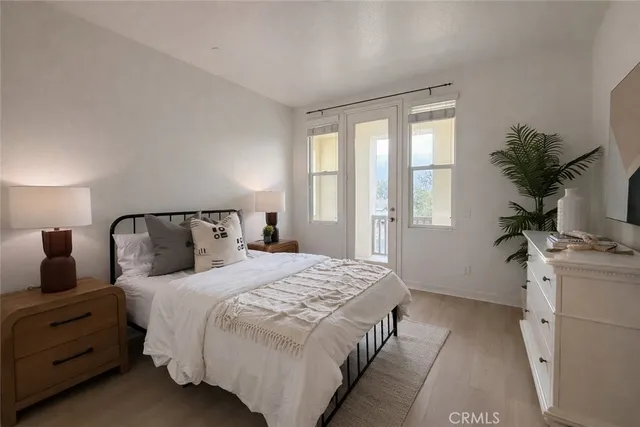 a bedroom with two beds and a dresser