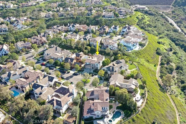 an aerial view of residential houses with outdoor space