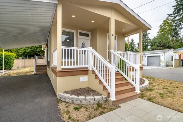 a view of a house with wooden floor and a fence