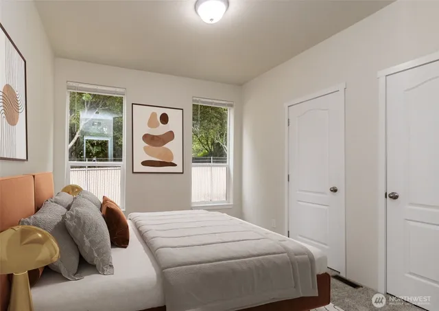 a bedroom with a bed and a window