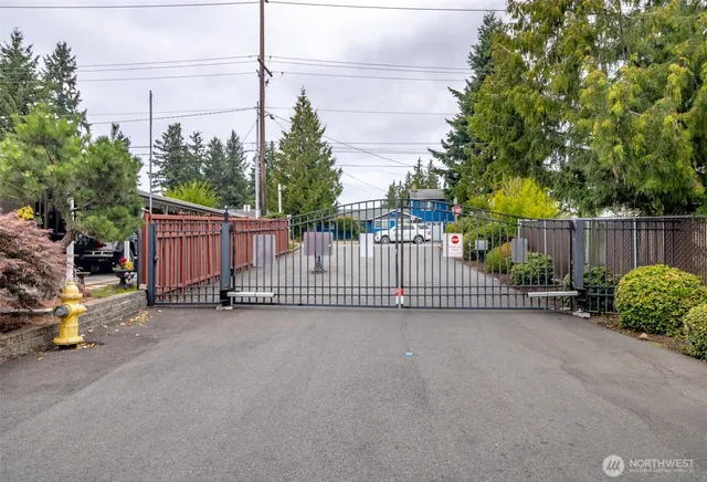 a view of a fence in a back yard