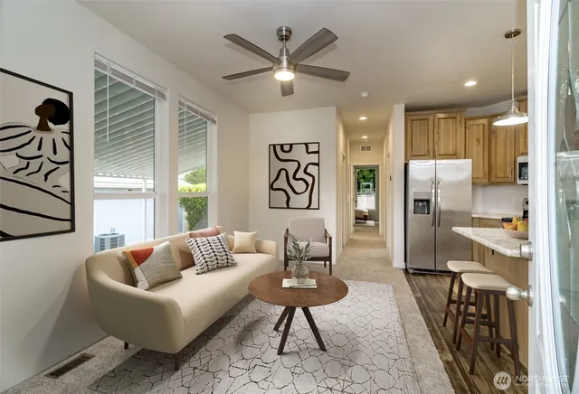 a living room with furniture and a chandelier
