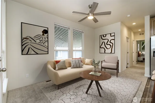 a living room with furniture and a rug