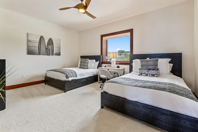 a bedroom with a bed and a chair