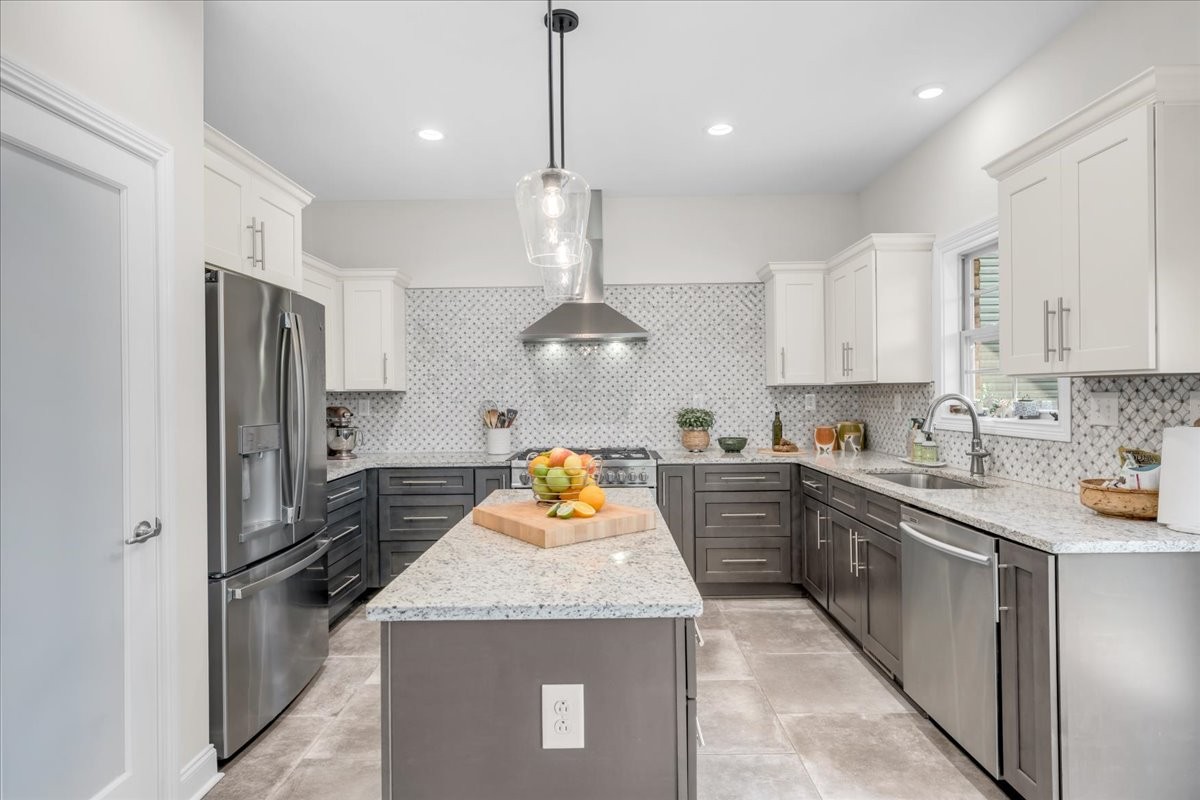3512 Ashland City Road Clarksville, TN 37043 - Photo 20 of 58 a kitchen with stainless steel appliances granite countertop a sink refrigerator and cabinets