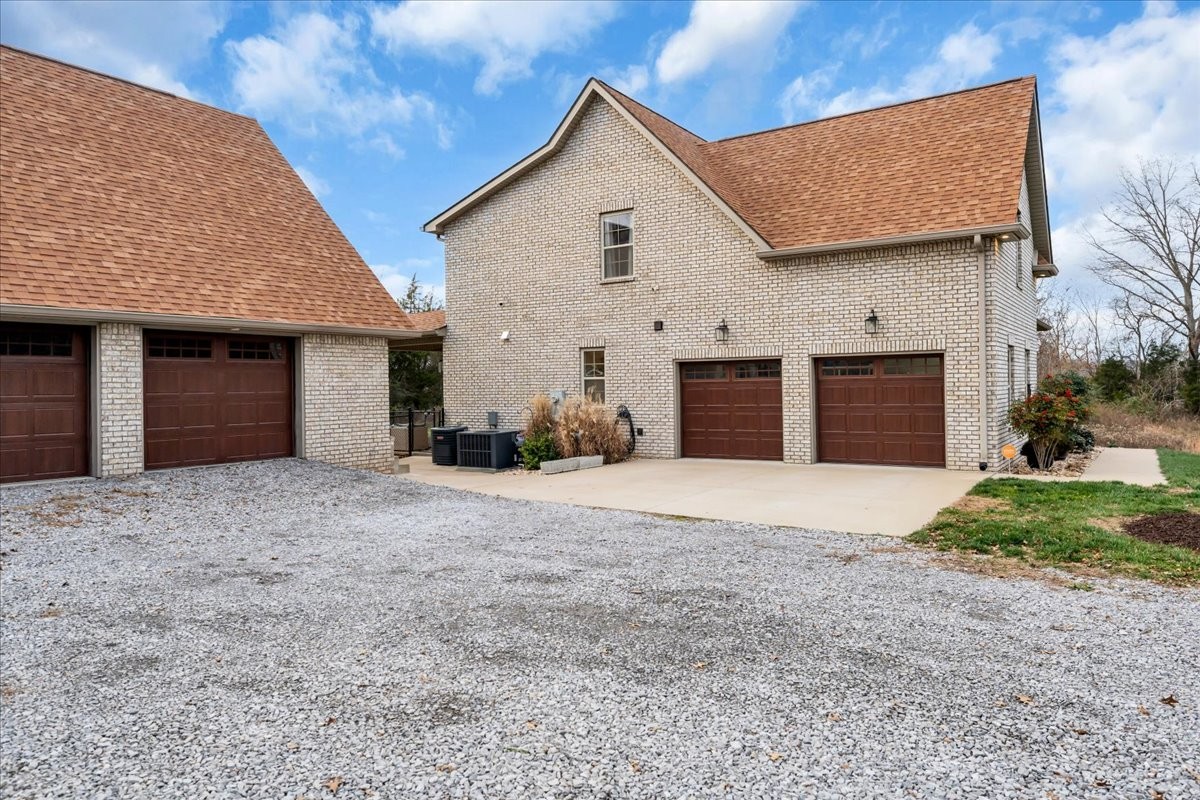 3512 Ashland City Road Clarksville, TN 37043 - Photo 46 of 58 a front view of a house with a yard and garage