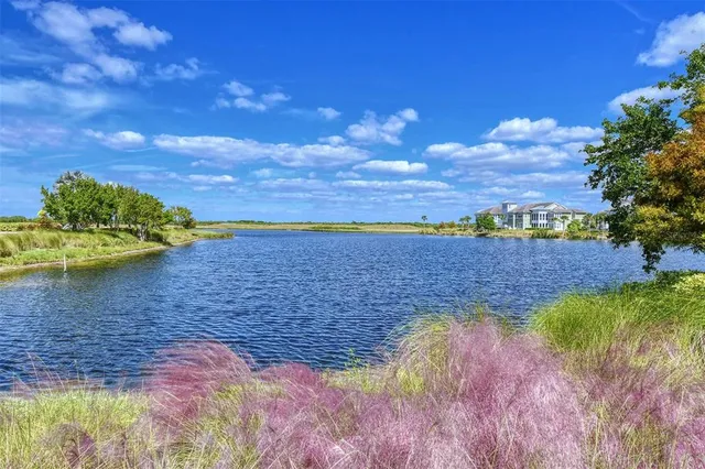 a front view of a house with a yard and outdoor seating