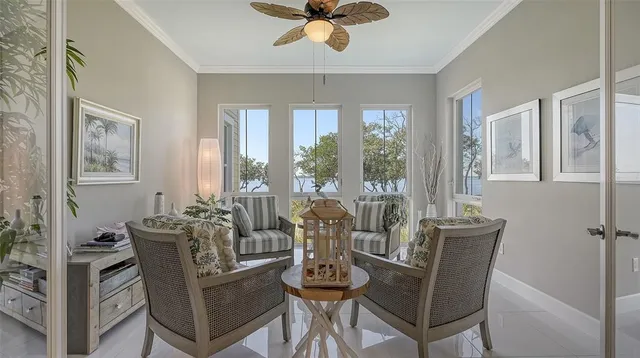 a bedroom with a bed a dresser and a large mirror next to a window