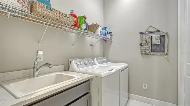 a bedroom with a bed table and a window
