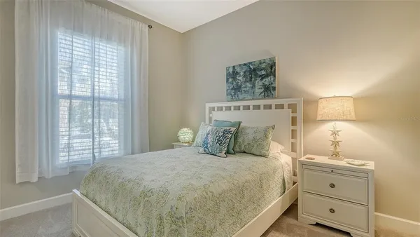 a view of a lake with a house in the background