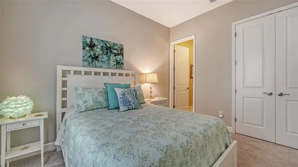 a view of a swimming pool with outdoor seating and plants