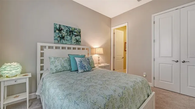 a view of a swimming pool with outdoor seating and plants