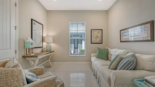 a view of a patio with couches chairs and a potted plant
