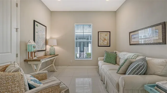 a view of a patio with couches chairs and a potted plant