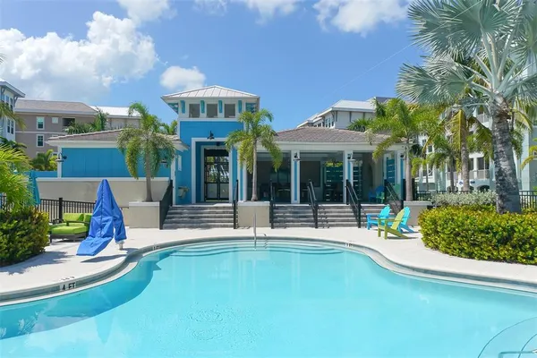 a view of a lake with houses in background