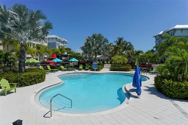 a view of a lake with a table and chairs