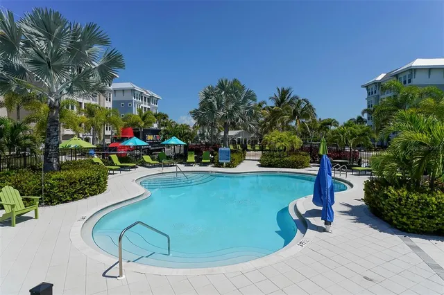 a view of a lake with a table and chairs