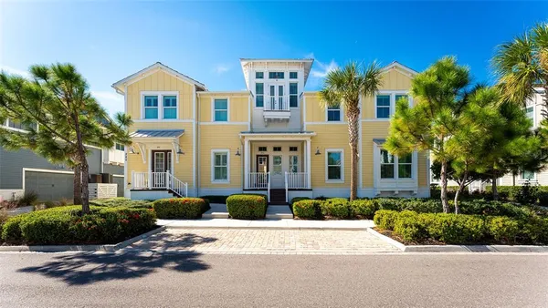a living room with furniture wooden floor and a view of kitchen