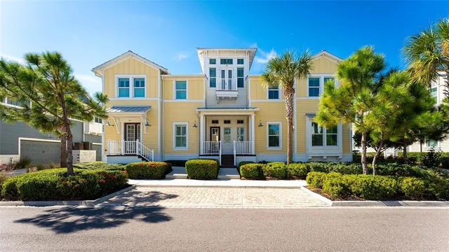 a living room with furniture wooden floor and a view of kitchen