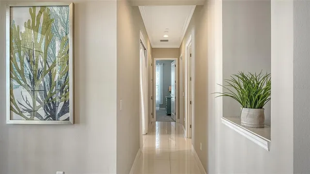 a kitchen with a table chairs and entryway
