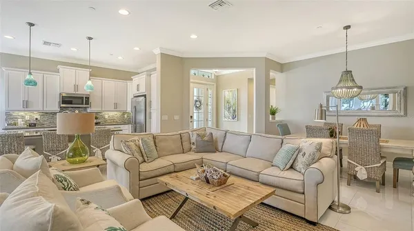 a kitchen with stainless steel appliances granite countertop a stove refrigerator and cabinets